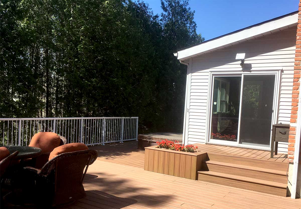 large composite deck with glass railing